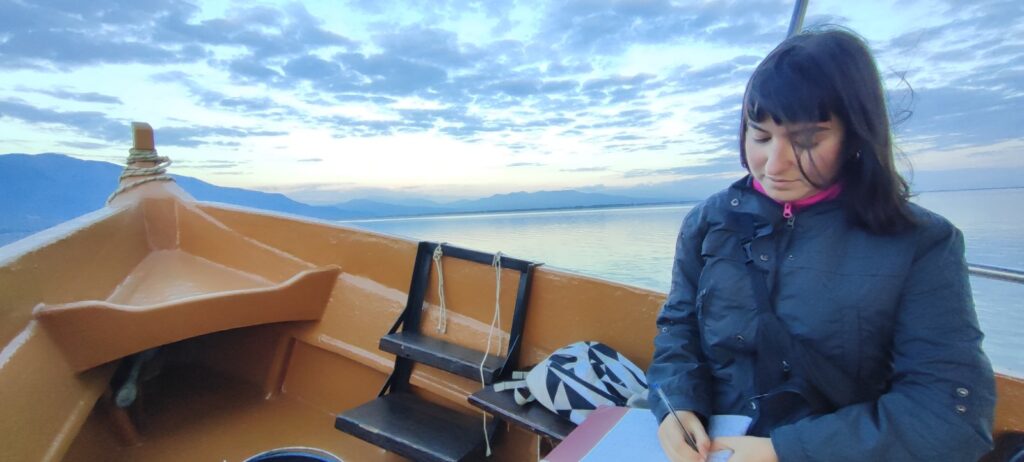 Woman in a boat in Lake Kerkini measuring Carbon Fluxes from the lake waters